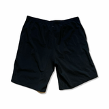 Svarta träningsshorts från Mountain Hardwear för herr, fotograferade bakifrån mot en vit bakgrund.