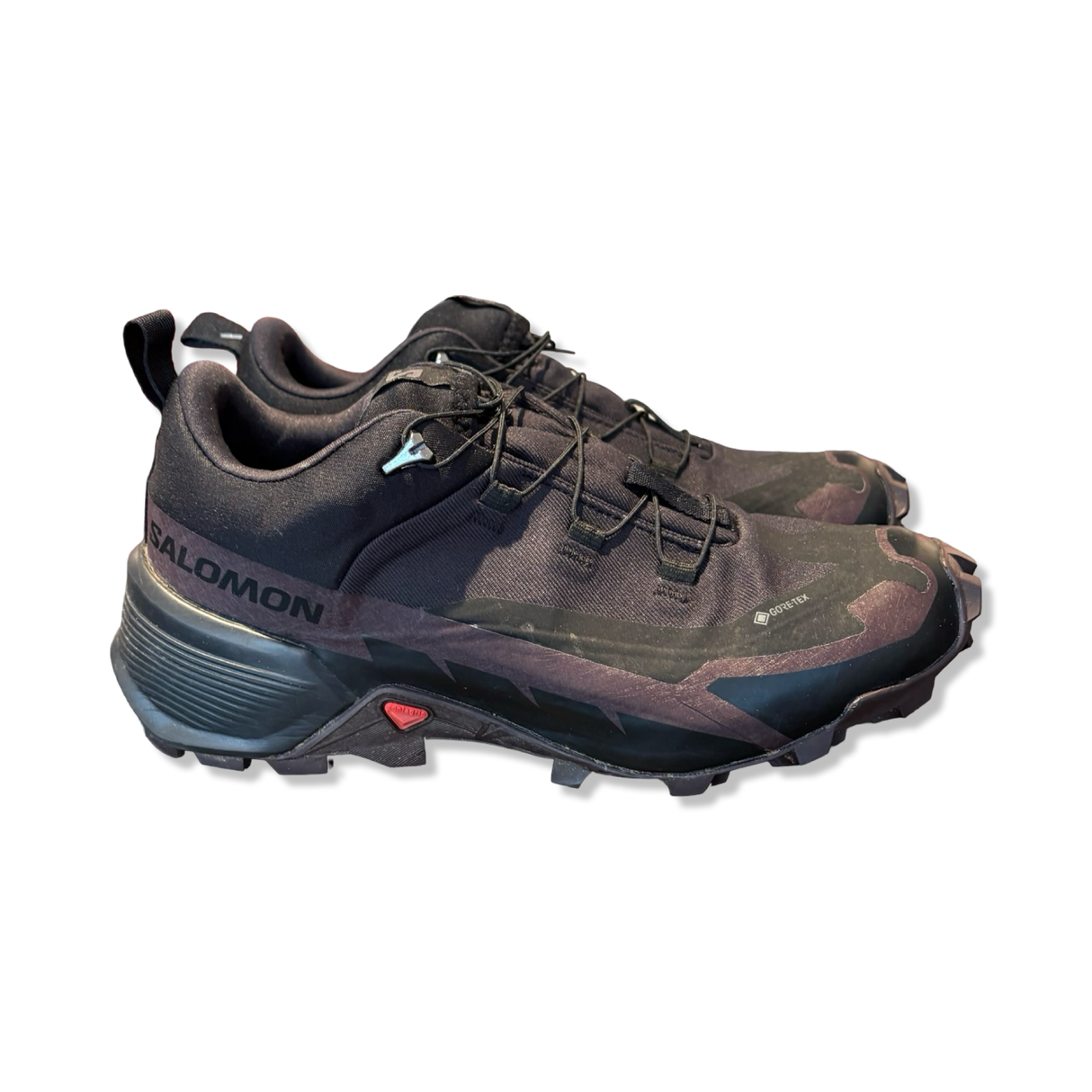 Women's black Salomon Gore-Tex hiking boots, side view against a white background.