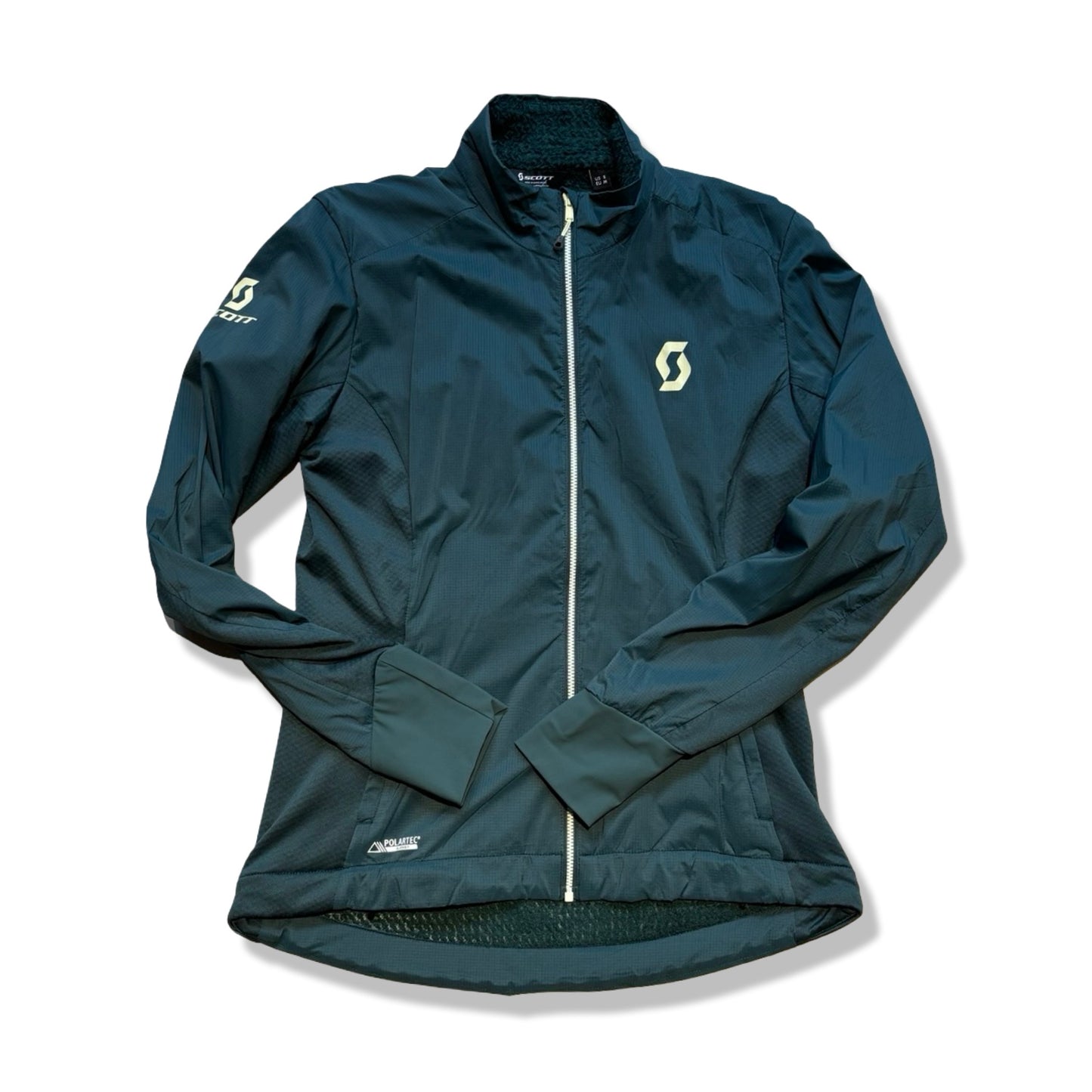 Scott syntetjacka för dam i grön. Jackan har en heldragen vit dragkedja och är fotograferad platt framifrån mot en vit bakgrund.