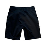Svarta Houdini Go Shorts för dam, funktionella vandringsshorts sedda bakifrån mot vit bakgrund.