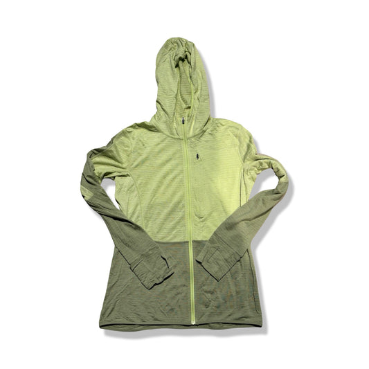 Underställströja Icebreaker Full för dam i ljusgrönt och olivgrönt, fotograferad framifrån mot en vit bakgrund.