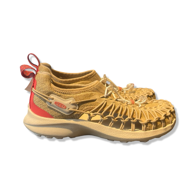 Women's beige Keen sandals with a red heel and braided design, side view against a white background.