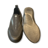 Women's black Stella McCartney ASMC Taekwondo slip-ins, featuring top-down and bottom views on a white background.
