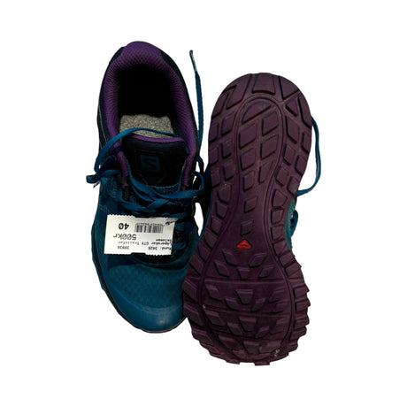 Salomon GTX Trailster löparskor för dam i blått och lila, där ena skon visar sulan, mot vit bakgrund.