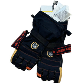 Svarta Hestra Ergo Grip Outdry Dexterity Long handskar med orangea detaljer, sedda ovanifrån mot en vit bakgrund.
