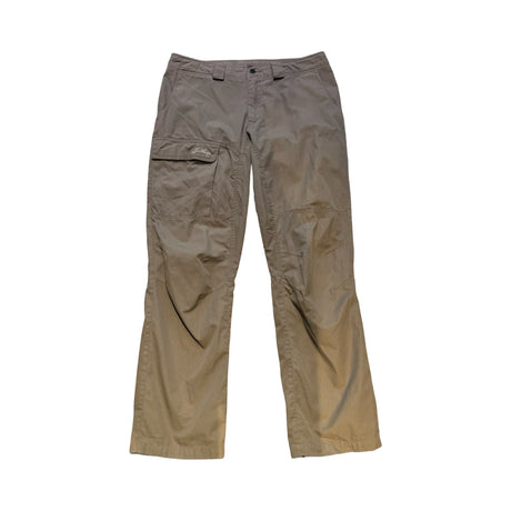 Beige Lundhags vandringsbyxor för dam i storlek 42 med benficka och logotyp, fotograferade mot en vit bakgrund.