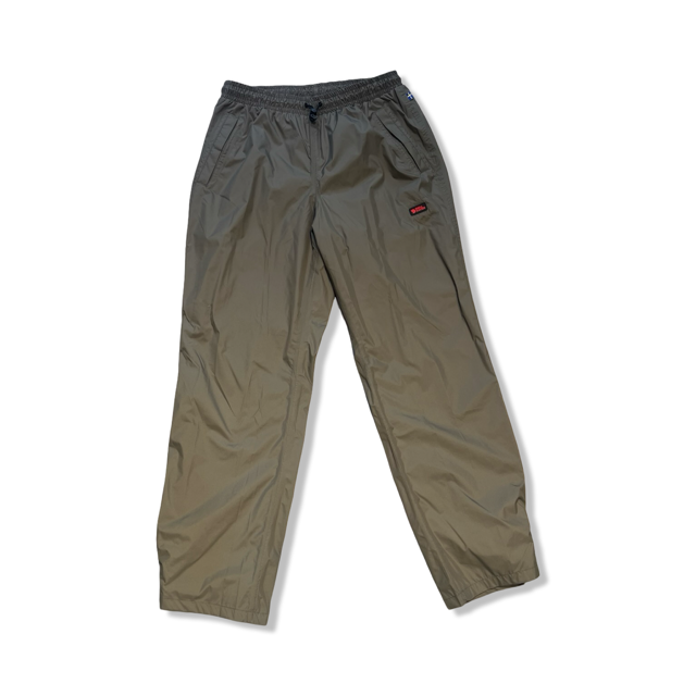 Beige Fjällräven Ruska rain pants featuring an elastic waist and logo, front view against a white background.