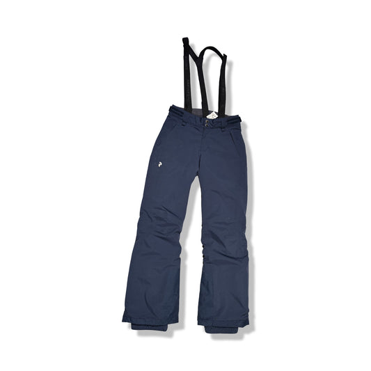 Peak Performance skidbyxa för dam i mörkblått med svarta hängslen, fotograferad framifrån mot en vit bakgrund.