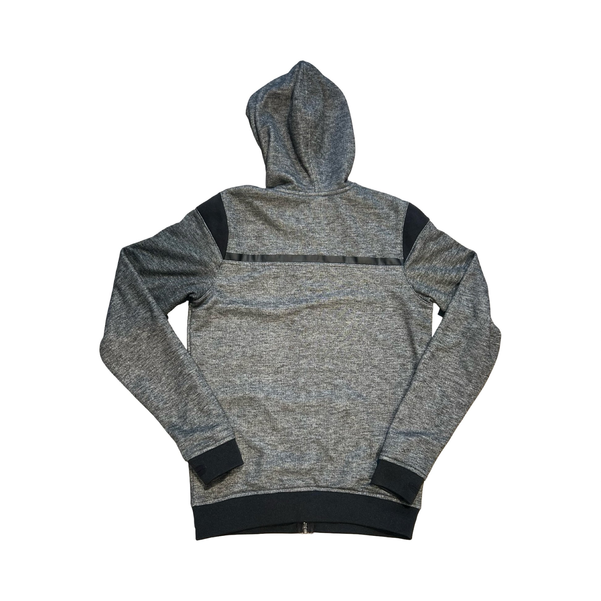 Baksidan av Timberland zip hoodie för unisex i gråmelerat med svarta detaljer.