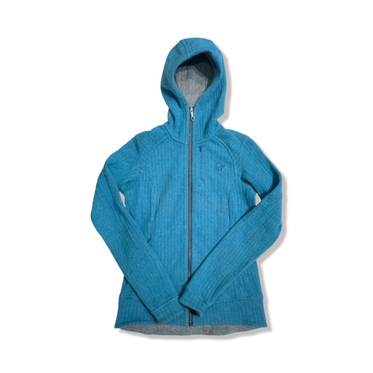 Fleecehoodie Norröna Röldal Wool för dam i blått, fotograferad framifrån mot en vit bakgrund.