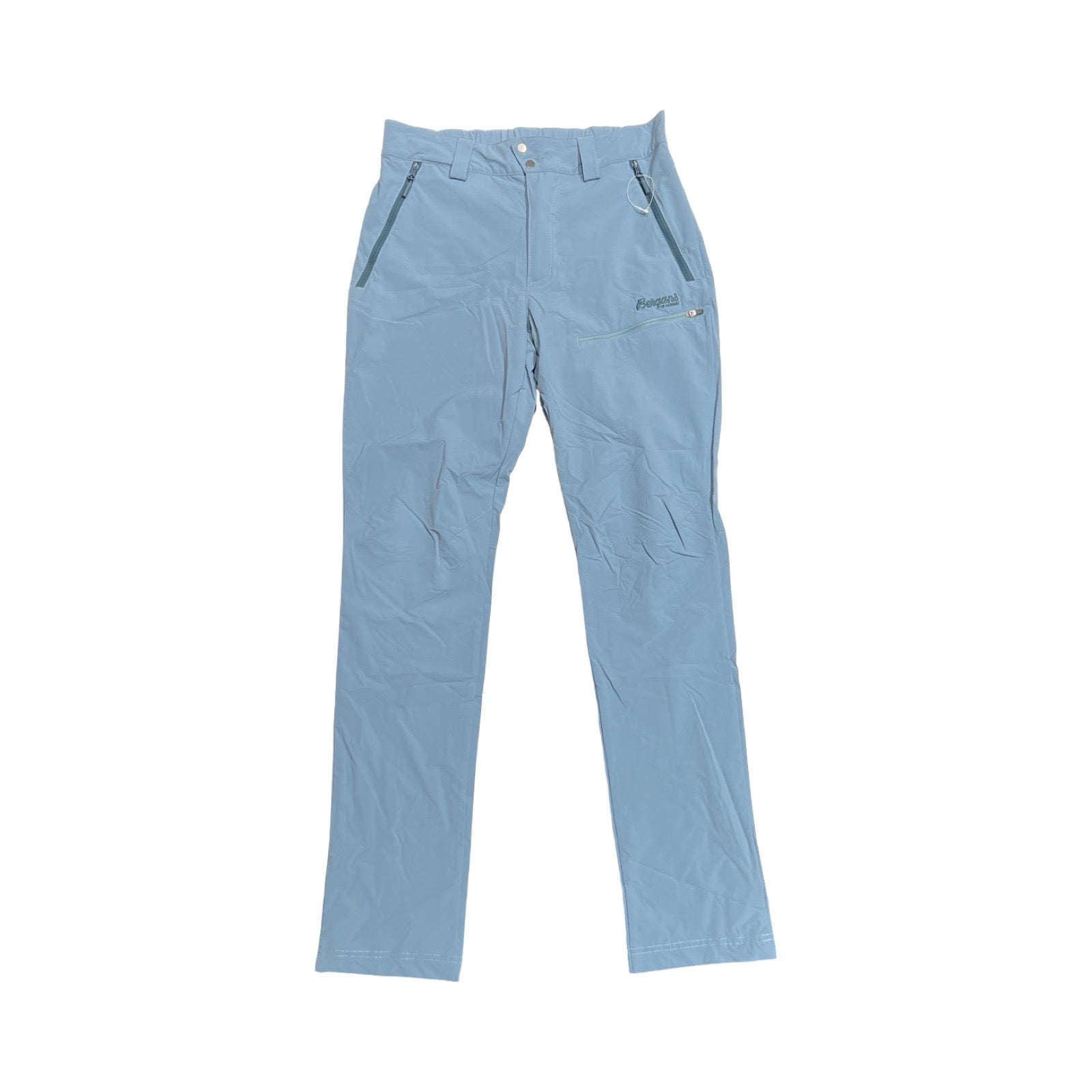 Bergans Tyin vandringsbyxa för dam i ljusblått, fotograferad platt framifrån mot en vit bakgrund.