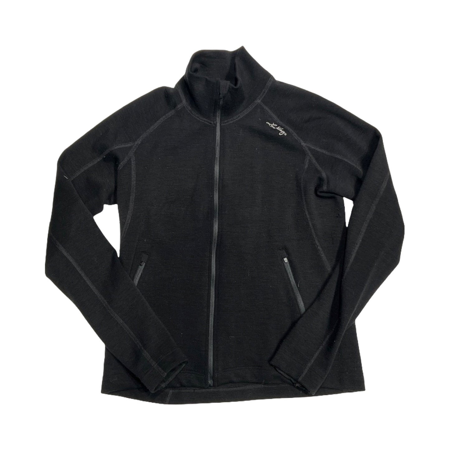 Lundhags Merino Full Zip funktionströja för dam i svart. Tröjan har en hög krage och heldragen dragkedja och är fotograferad platt mot en vit bakgrund.