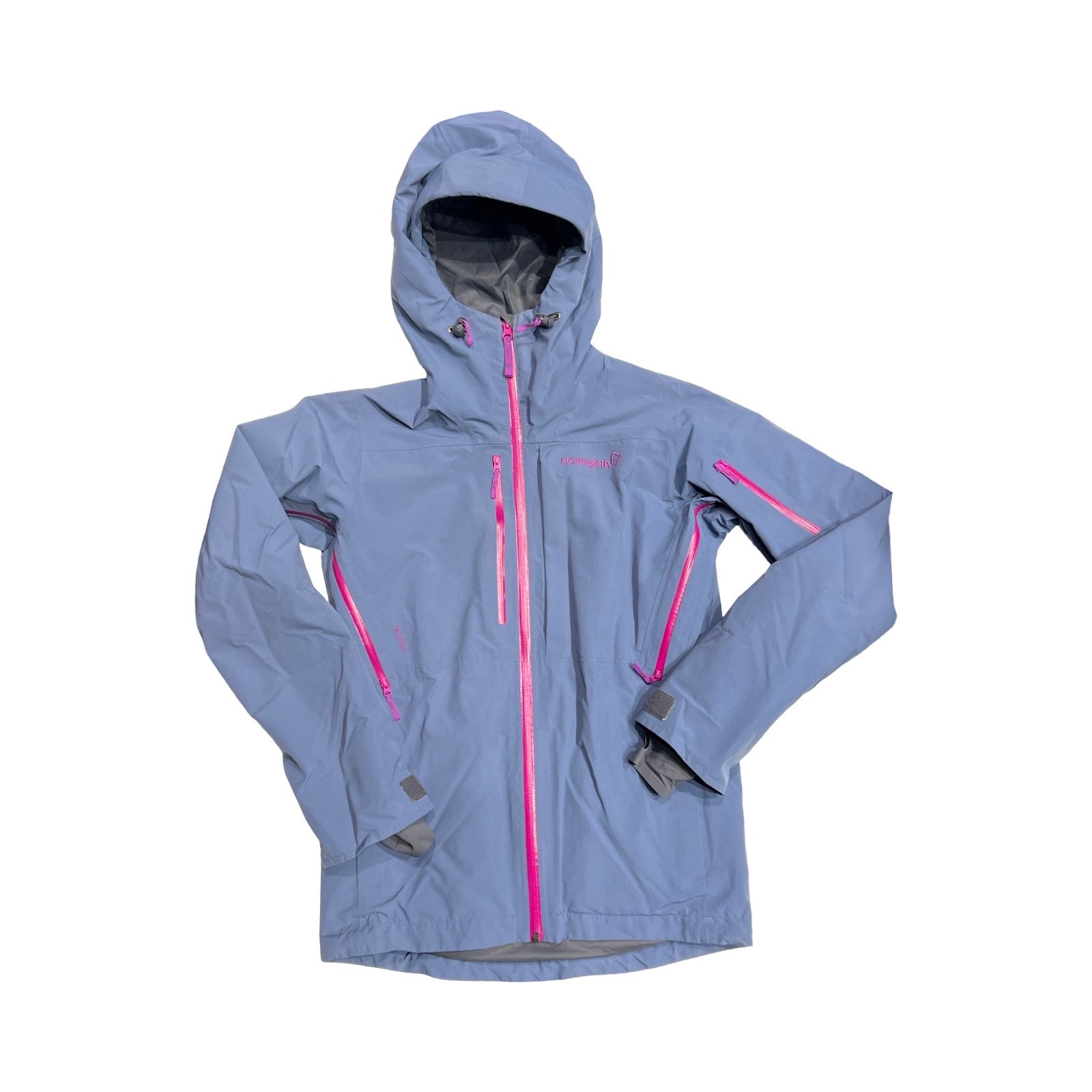 Norröna Lofoten Gore-Tex skidjacka för barn i lila med rosa dragkedjor. Jackan har huva och heldragen dragkedja och är fotograferad platt mot en vit bakgrund.