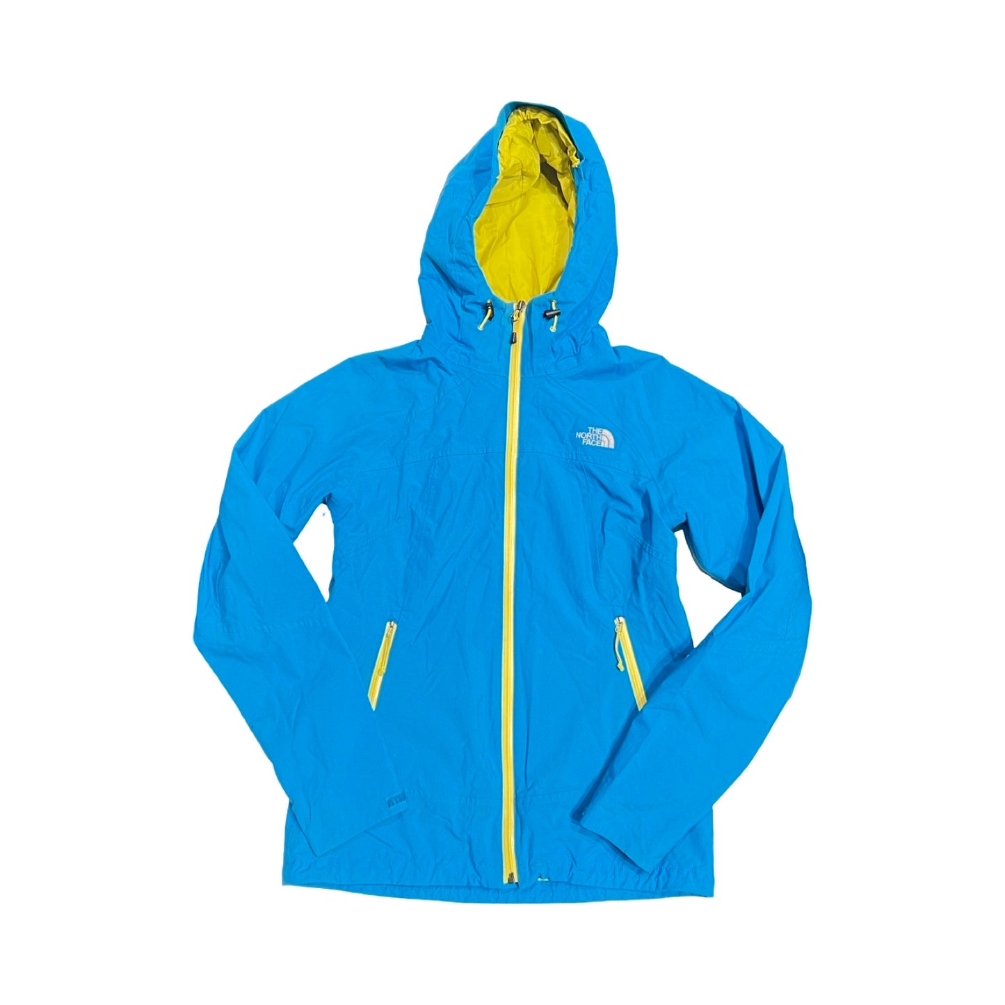 The North Face skaljacka för dam i blått med gula detaljer. Jackan har huva och heldragen dragkedja och är fotograferad platt mot en vit bakgrund.