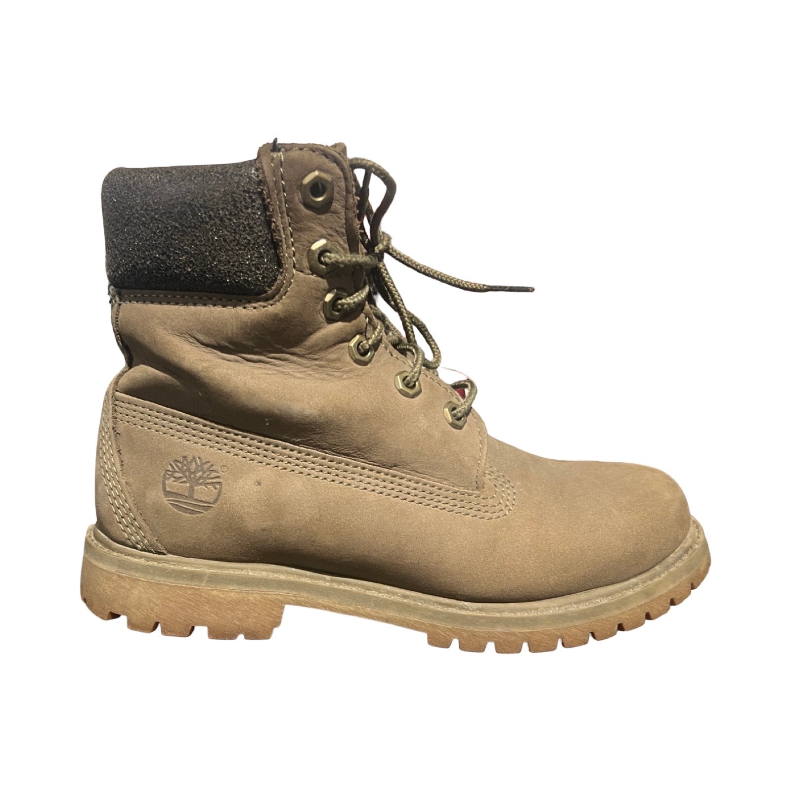 Timberland känga för dam i grått, fotograferad i profil mot en vit bakgrund.