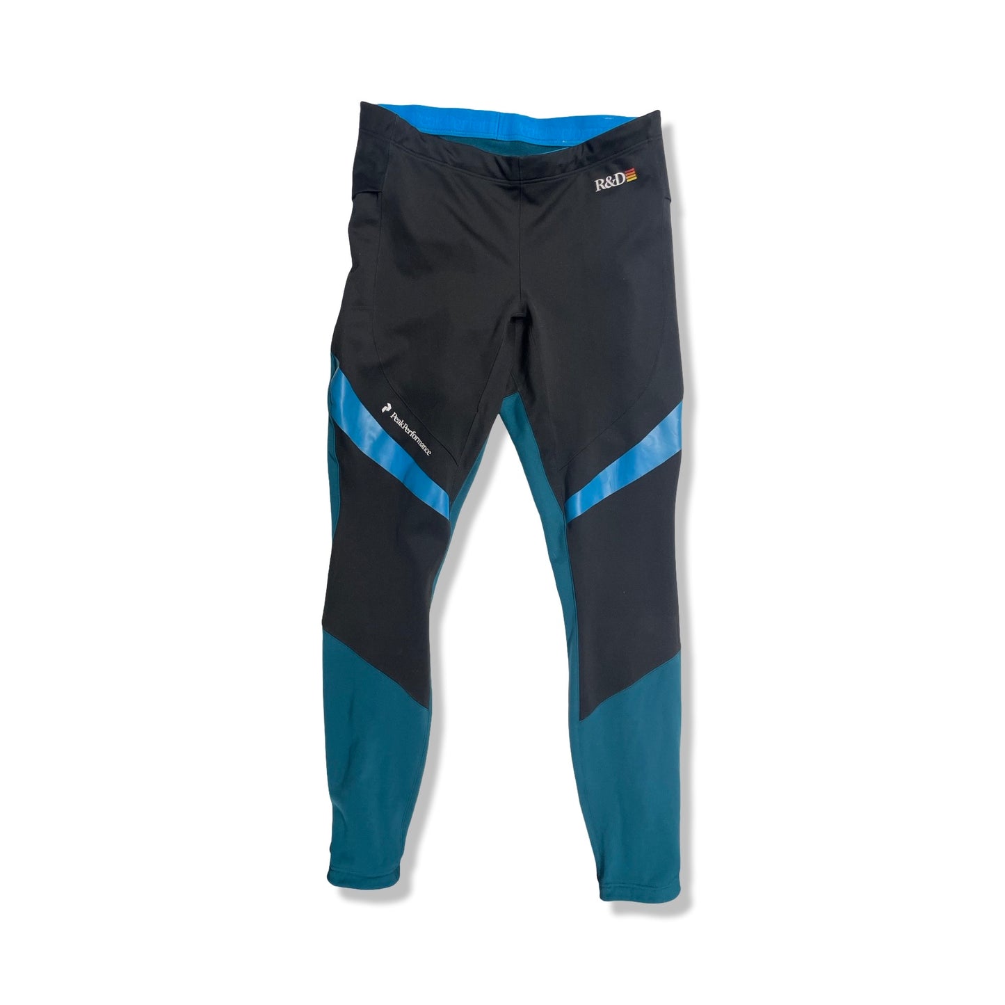 Peak Performance fleecebyxa för dam i svart, turkos och blått, fotograferad framifrån mot en vit bakgrund.