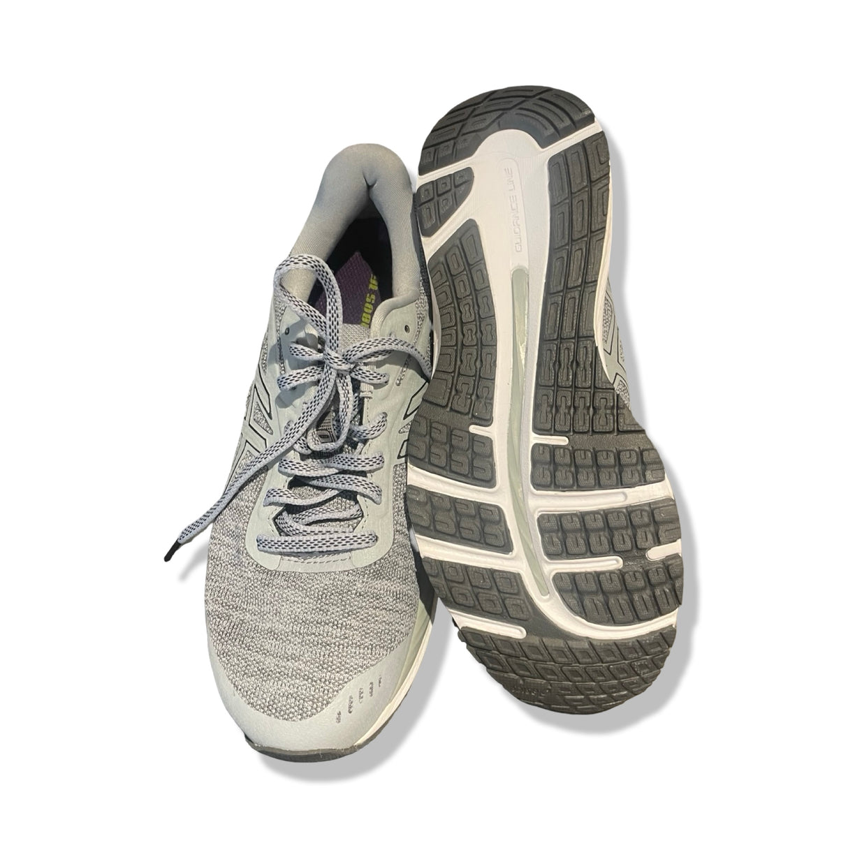 Asics GEL-Nimbus löparskor i blått, där ena skon visas uppifrån och den andra visar sulan mot en vit bakgrund.