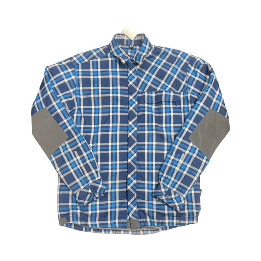 Haglöfs Tundra syntetjacka för herr i blått och vitt rutmönster, isolerad med Quad Fusion+. Jackan har grå förstärkningar på armbågarna och är fotograferad framifrån, platt liggande mot en vit bakgrund.