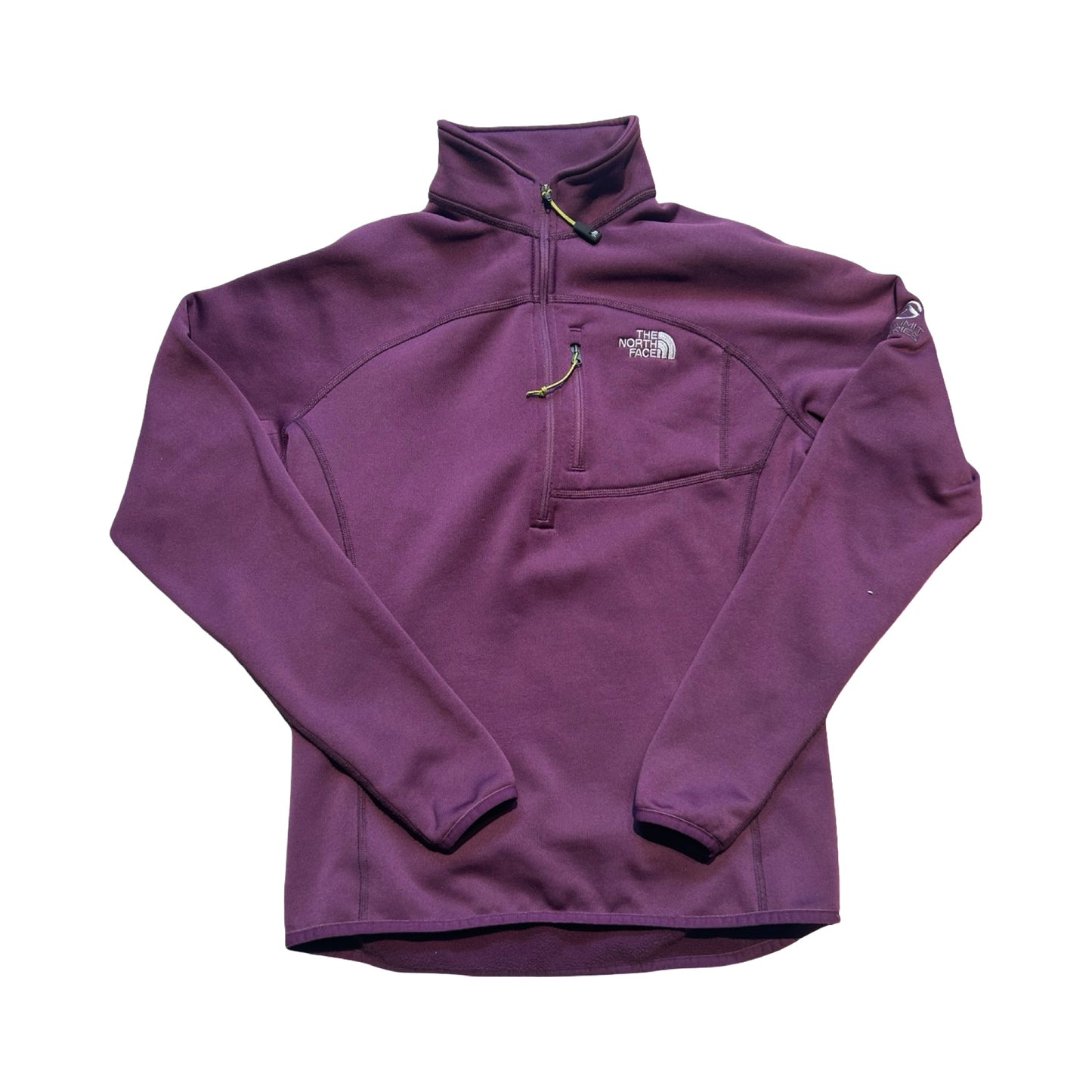 The North Face Summit fleecetröja för dam i lila. Tröjan har en hög krage med dragkedja och en bröstficka och är fotograferad framifrån mot en vit bakgrund.