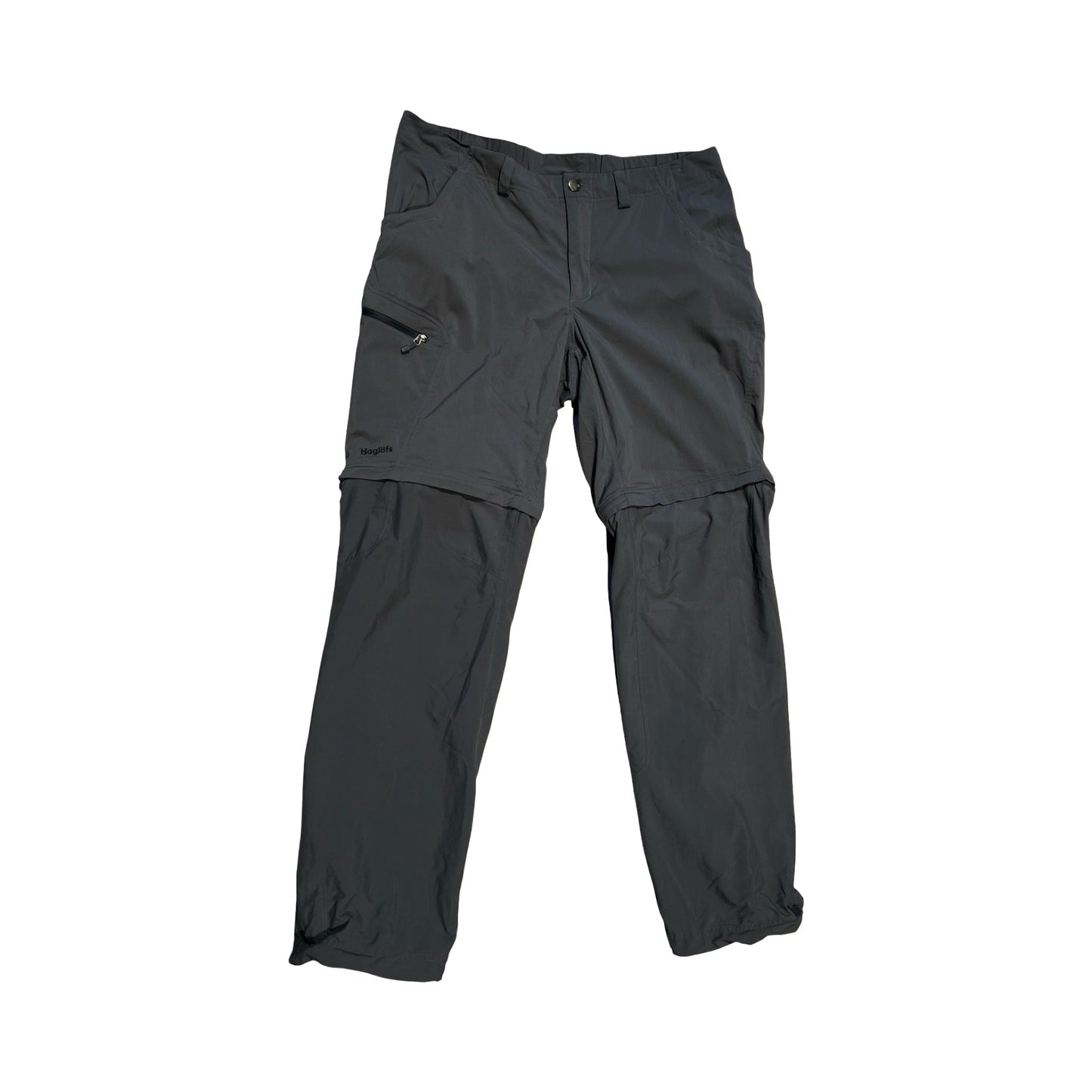 Haglöfs zip-off funktionsbyxor för dam i grått. Byxorna är fotograferade platt framifrån mot en vit bakgrund.